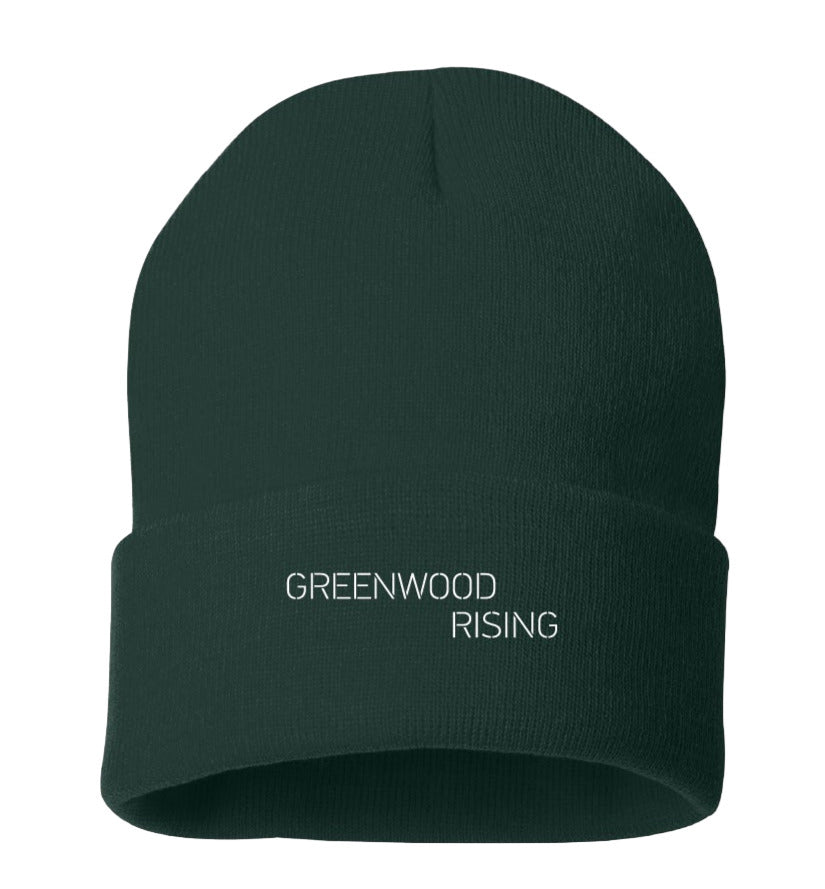 Greenwood Rising merchandise with a beanie and check list on a black background