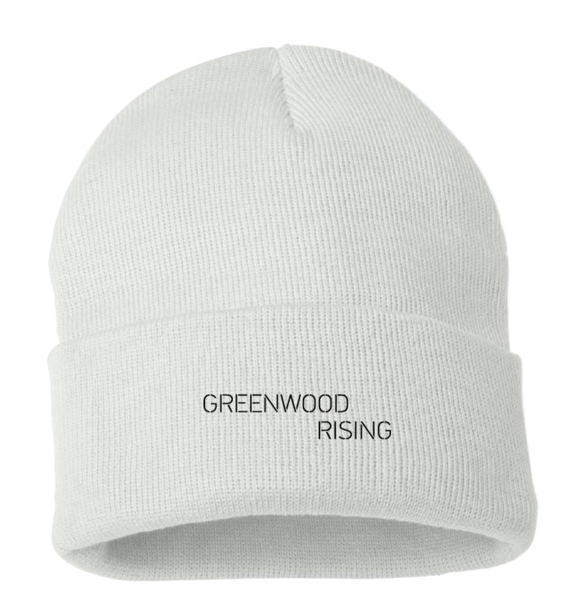 White beanie with 'Greenwood Rising' text on a design checklist background